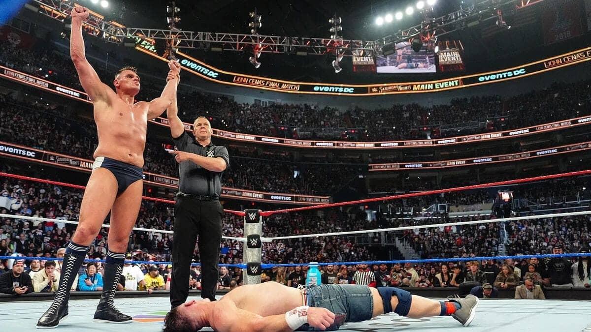Gunther celebrates as John Cena retires after their match