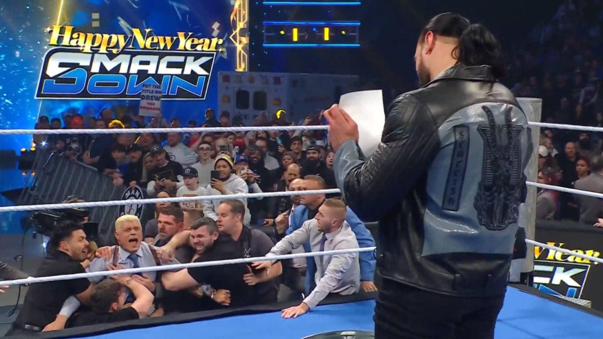 Cody Rhodes reacts as McIntyre sets family photo ablaze