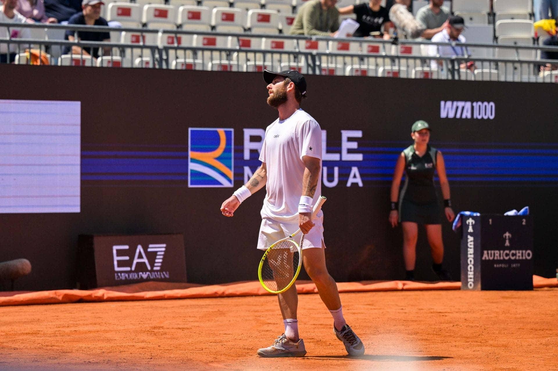 Moutet's Magical Mishap: A Racket and Shorts Showdown
